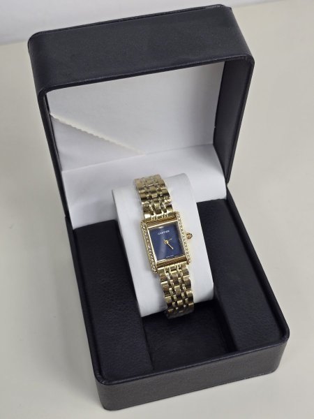 ساعه Cartier ذهبي ارضيه كحلي